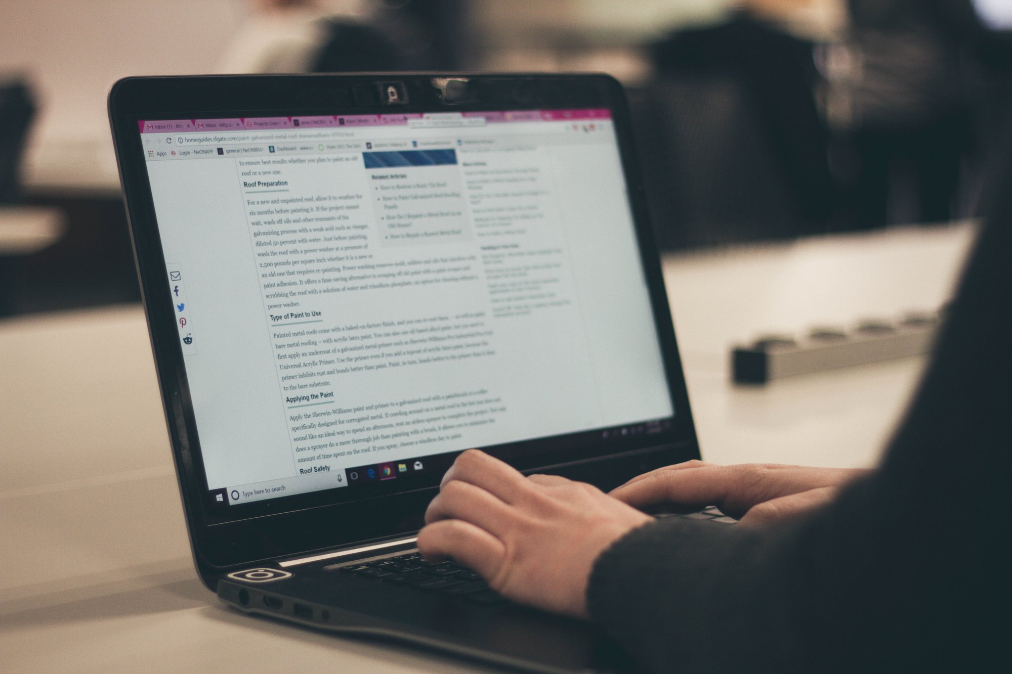 man writing on a laptop