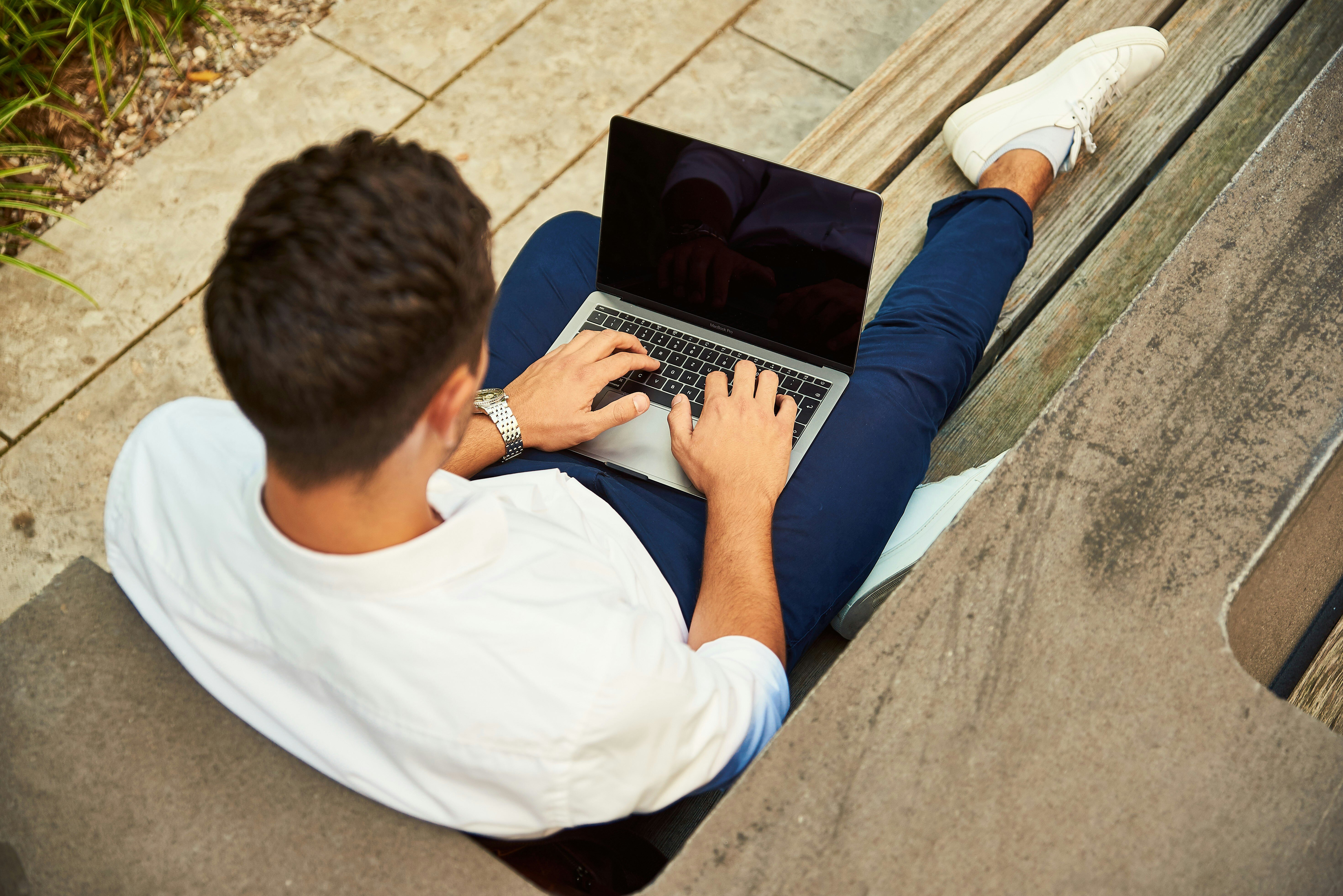 person typing on laptop